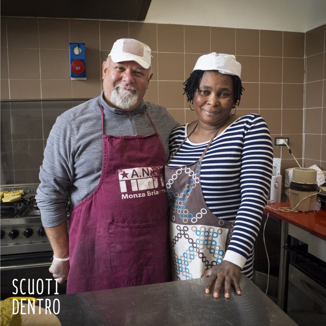 Men and women in aprons cross their shoulders with a smile