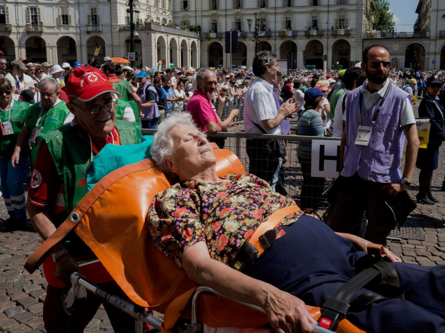 Old woman lying on a stretcher