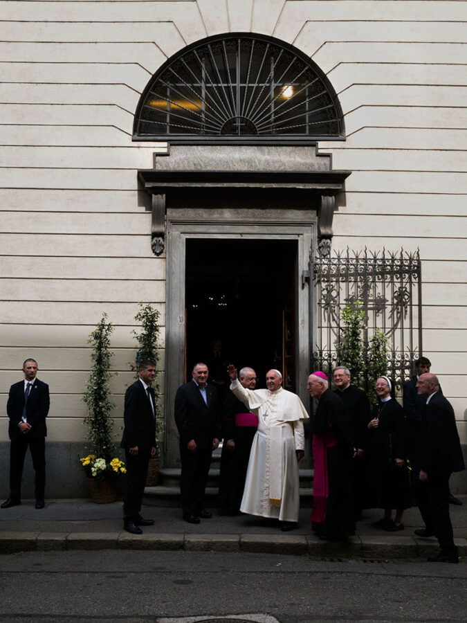Pope waving with a smile