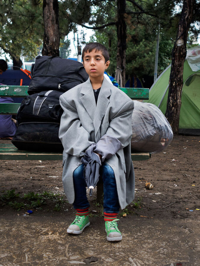 A child wearing a huge jacket
